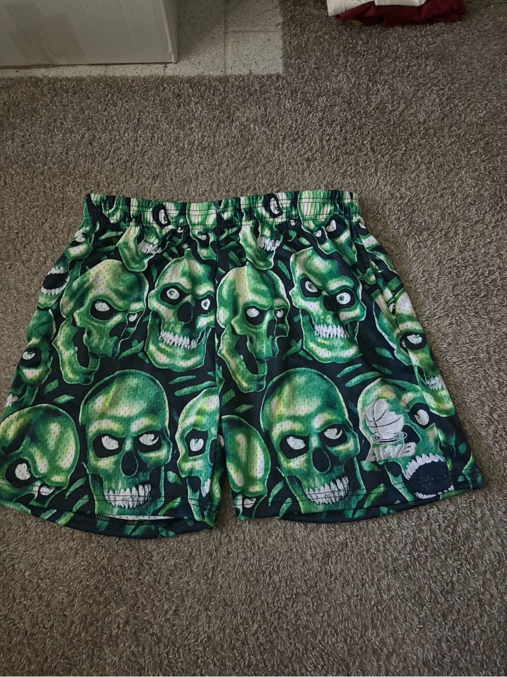 Green skulls mesh shorts
